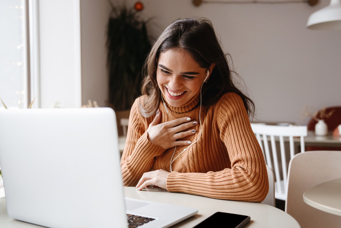 Happy Woman Video Chatting on her Laptop 